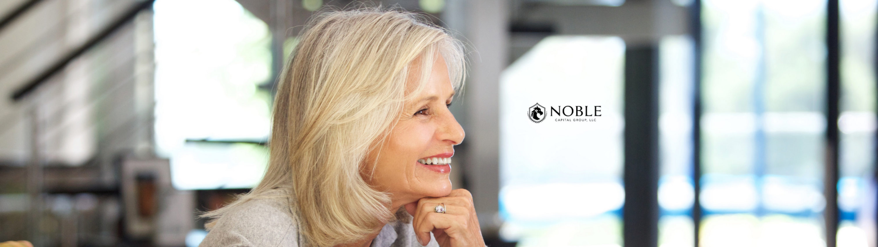 Confident senior woman in a bright, modern setting, representing financial peace of mind through personalized retirement and Social Security planning